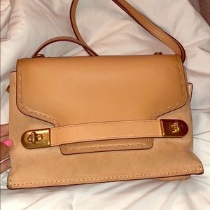 Peach colored coach purse